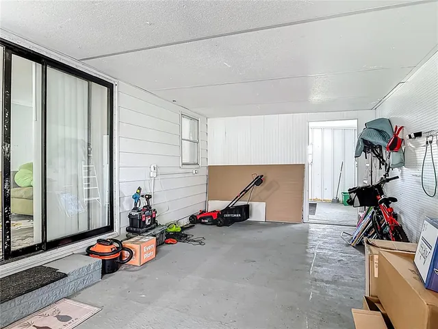 a view of a backyard with a garden and entertaining space