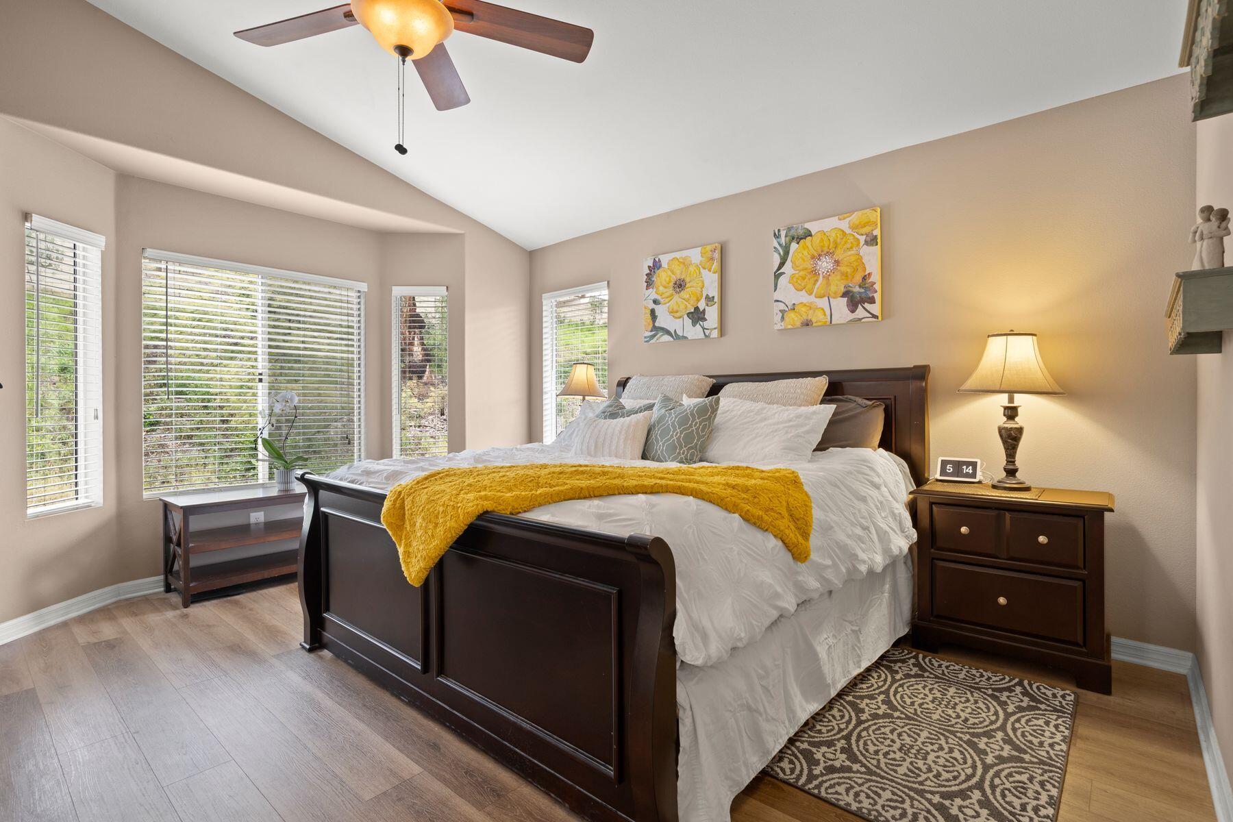 697 Buenos Tiempos Drive Camarillo, CA 93012 - Photo 14 of 29 a bedroom with a bed and a chandelier