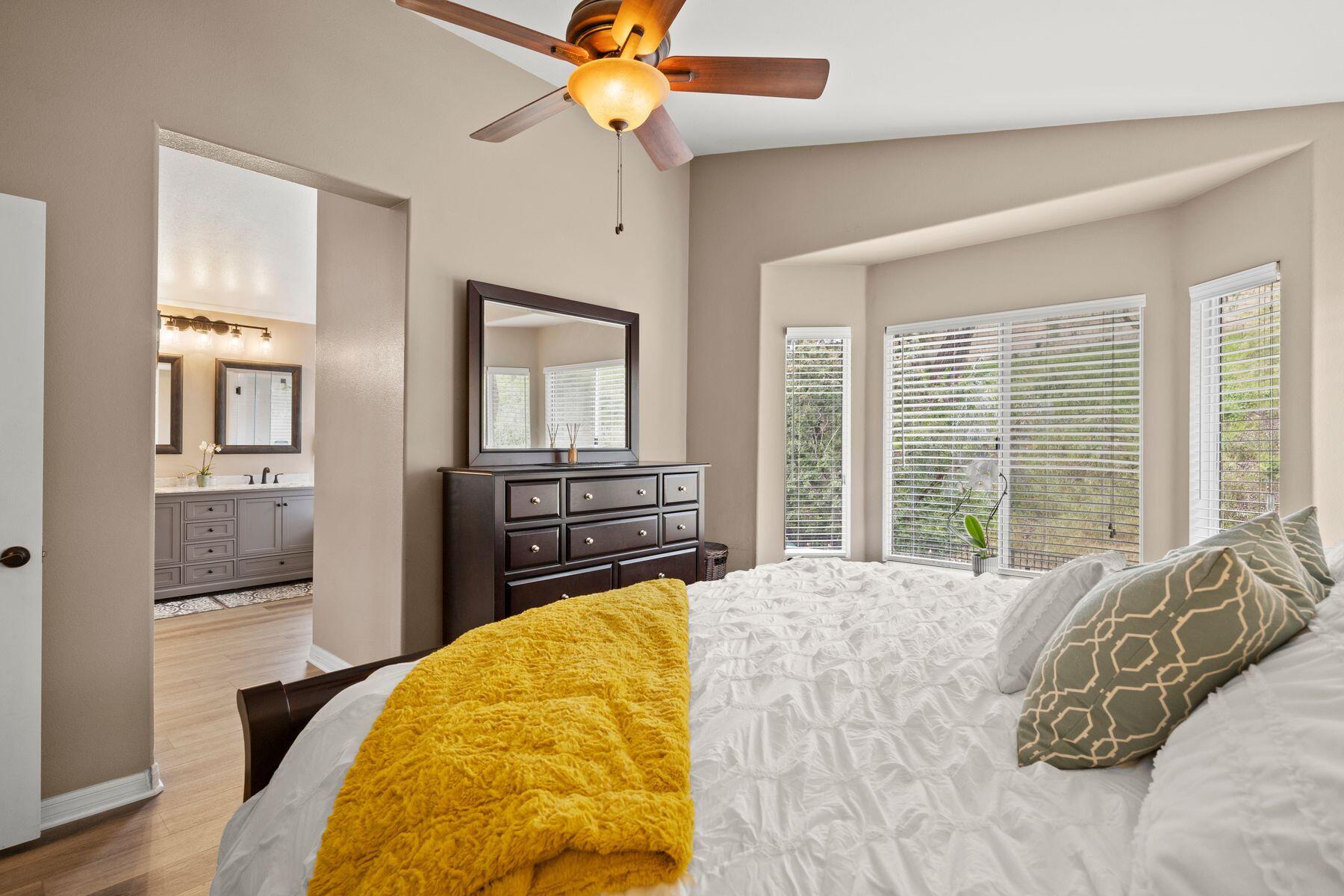 697 Buenos Tiempos Drive Camarillo, CA 93012 - Photo 15 of 29 a bedroom with a bed and a chandelier