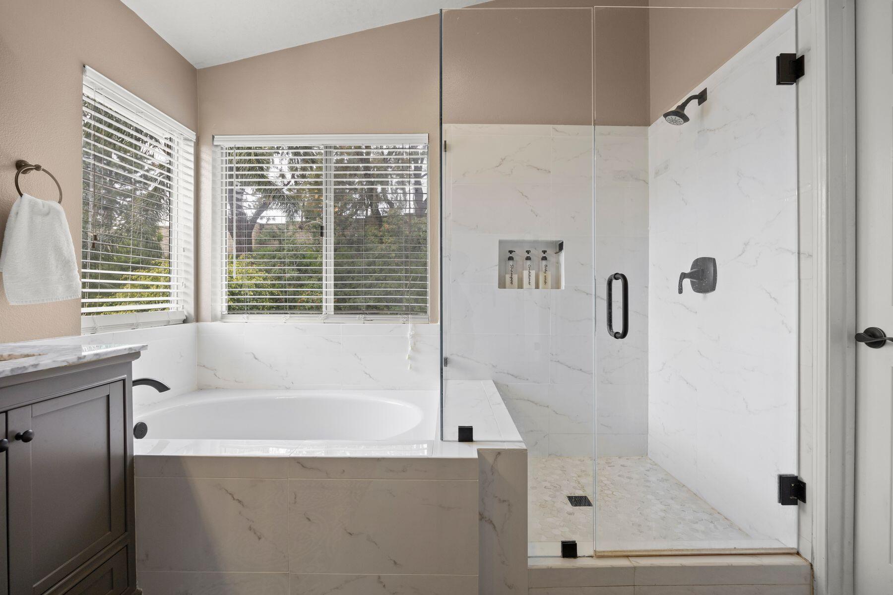 697 Buenos Tiempos Drive Camarillo, CA 93012 - Photo 17 of 29 a bathroom with a bathtub and a shower