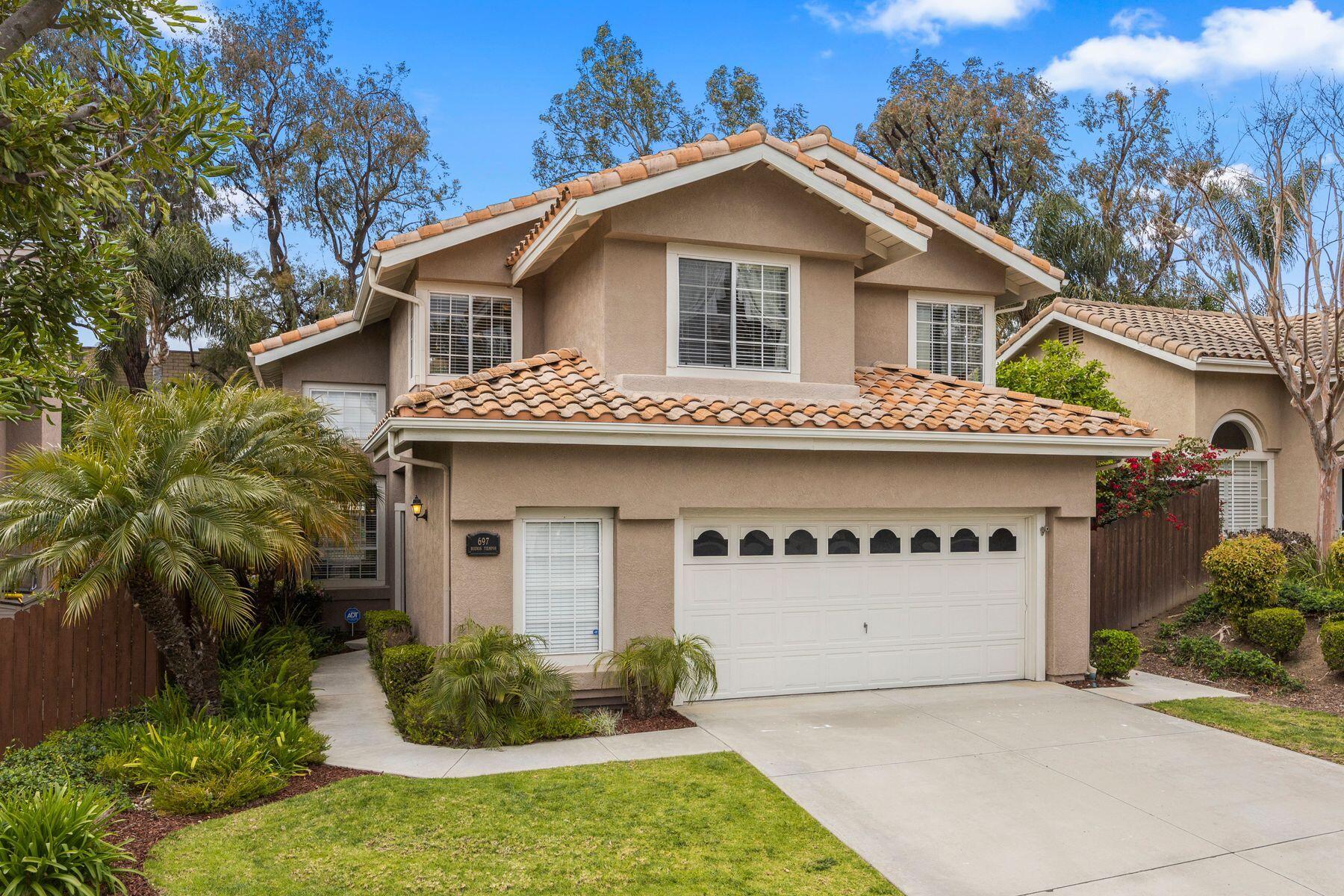 697 Buenos Tiempos Drive Camarillo, CA 93012 - Photo 25 of 29 a view of a white house with large windows and plants