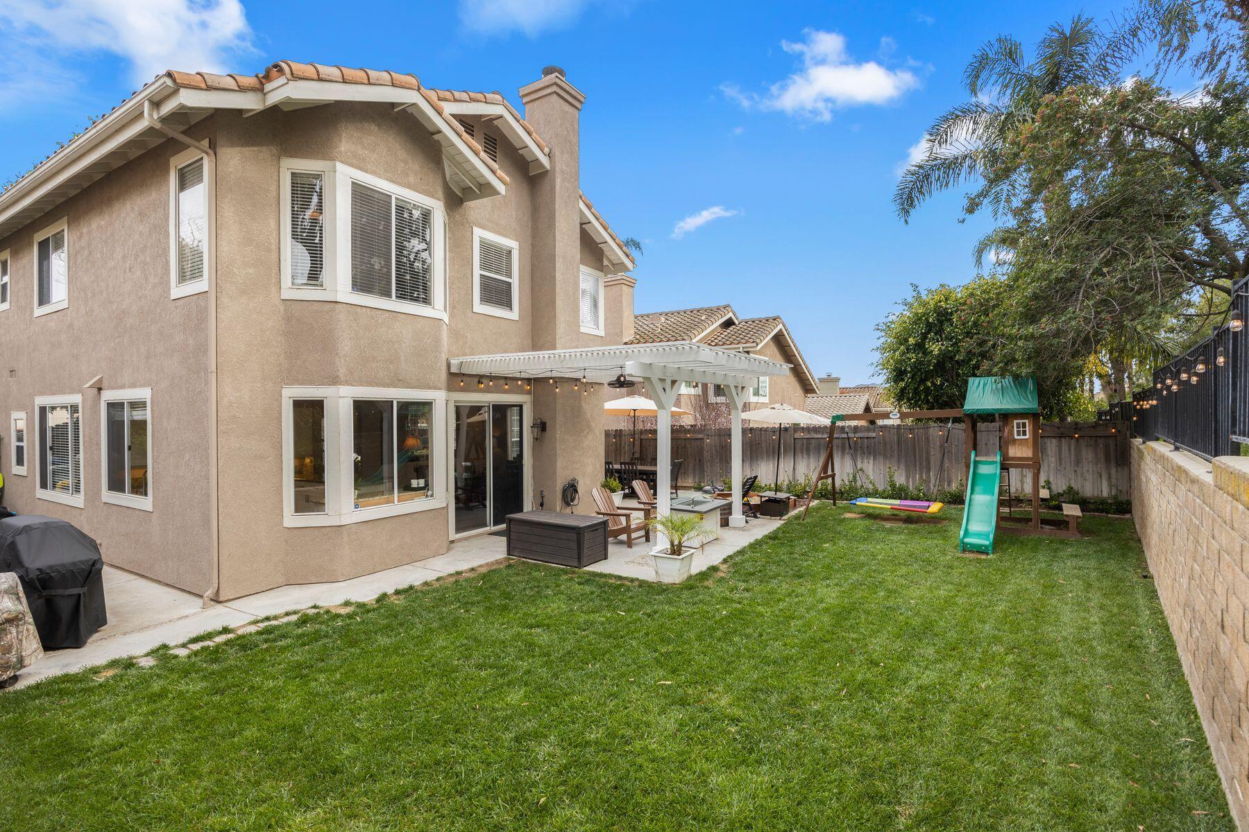 697 Buenos Tiempos Drive Camarillo, CA 93012 - Photo 26 of 29 a view of a house with a yard and sitting area