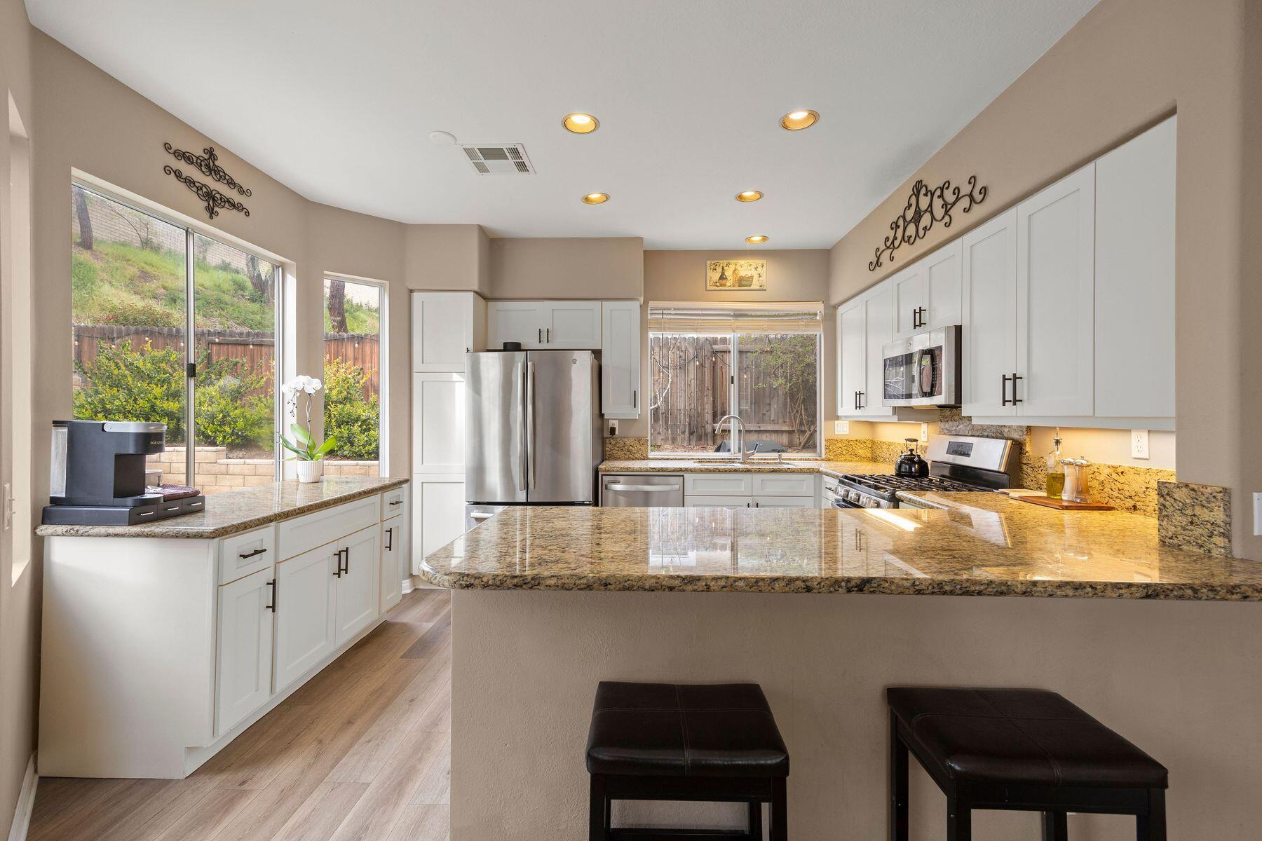 697 Buenos Tiempos Drive Camarillo, CA 93012 - Photo 4 of 29 a large kitchen with granite countertop lots of counter space and window