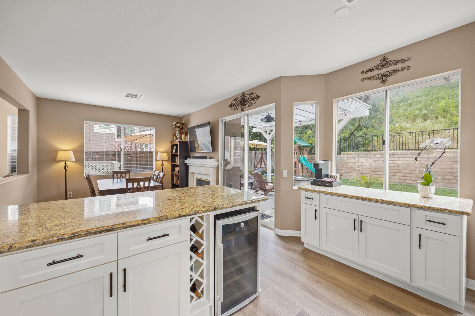 697 Buenos Tiempos Drive Camarillo, CA 93012 - Photo 6 of 29 a large kitchen with kitchen island granite countertop a large window