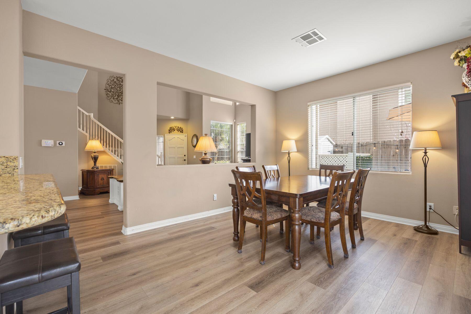 697 Buenos Tiempos Drive Camarillo, CA 93012 - Photo 7 of 29 a view of a dining room with furniture and wooden floor