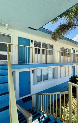 a view of a house with wooden deck