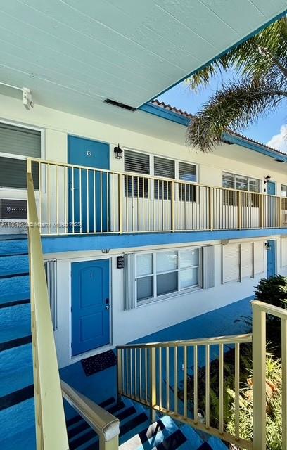 3212 Northeast 8th Court, Unit 12 Pompano Beach, FL 33062 - Photo 11 of 17 a view of a house with wooden deck