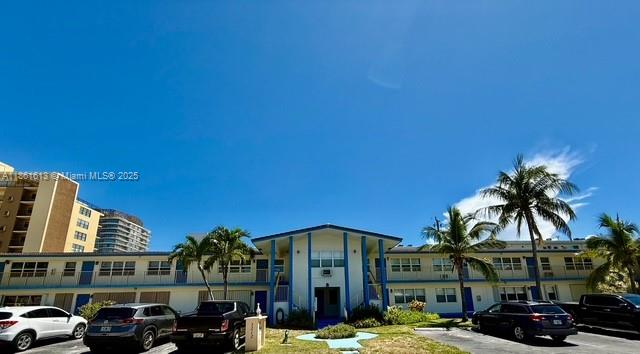 3212 Northeast 8th Court, Unit 12 Pompano Beach, FL 33062 - Photo 17 of 17 a couple of cars parked in front of a building
