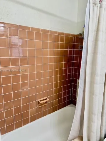 a view of a bathroom with a bathtub