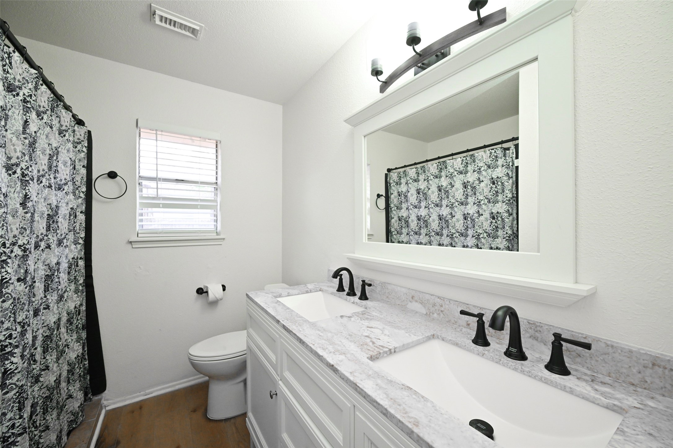 17831 Magnolia Lane New Caney, TX 77357 - Photo 12 of 27 Here is the shared bathroom that includes a shower/tub combination!