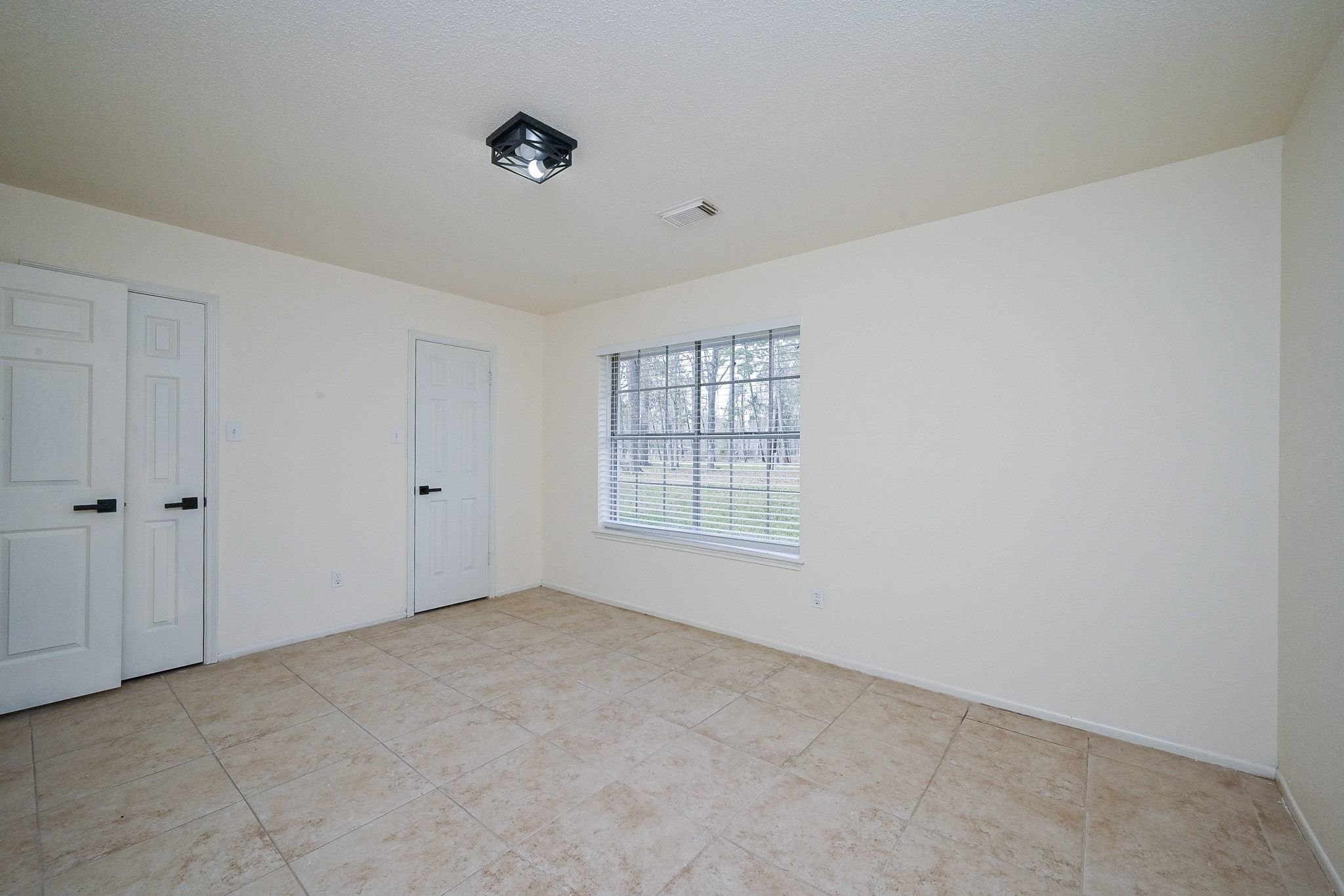 17831 Magnolia Lane New Caney, TX 77357 - Photo 13 of 27 Here is the third bedroom! Imagine the unlimited possibilities that this room has! This oasis is perfect for a guest bedroom, media room, in-home office, or any of your desires!