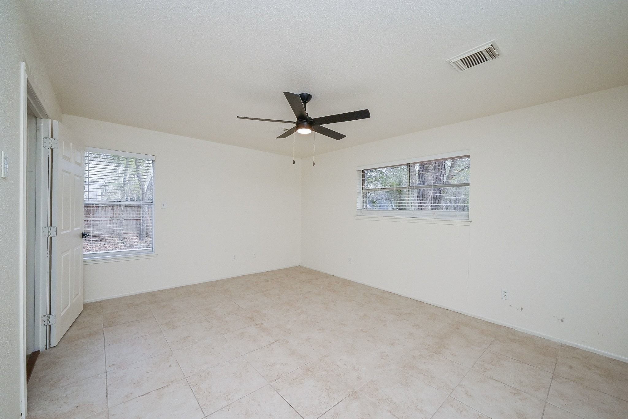 17831 Magnolia Lane New Caney, TX 77357 - Photo 14 of 27 Here is the spacious primary bedroom! Notice the spacious walls and tall ceilings, giving an open and spacious feel!