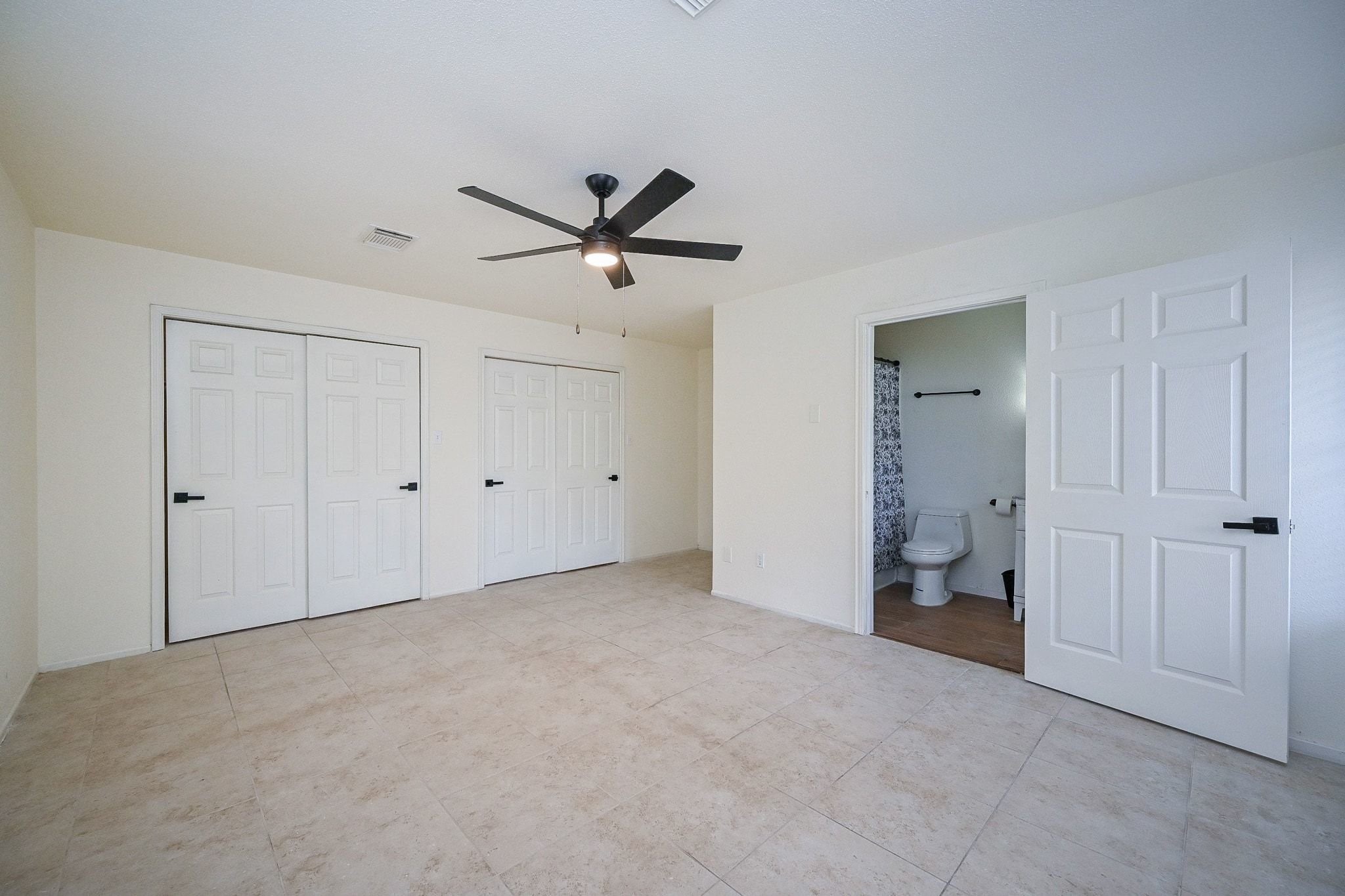 17831 Magnolia Lane New Caney, TX 77357 - Photo 16 of 27 Take a look at the huge double doors for his and hers closets! This space is the perfect getaway after a long, stressful day! This is the best scenery to rest and relax.