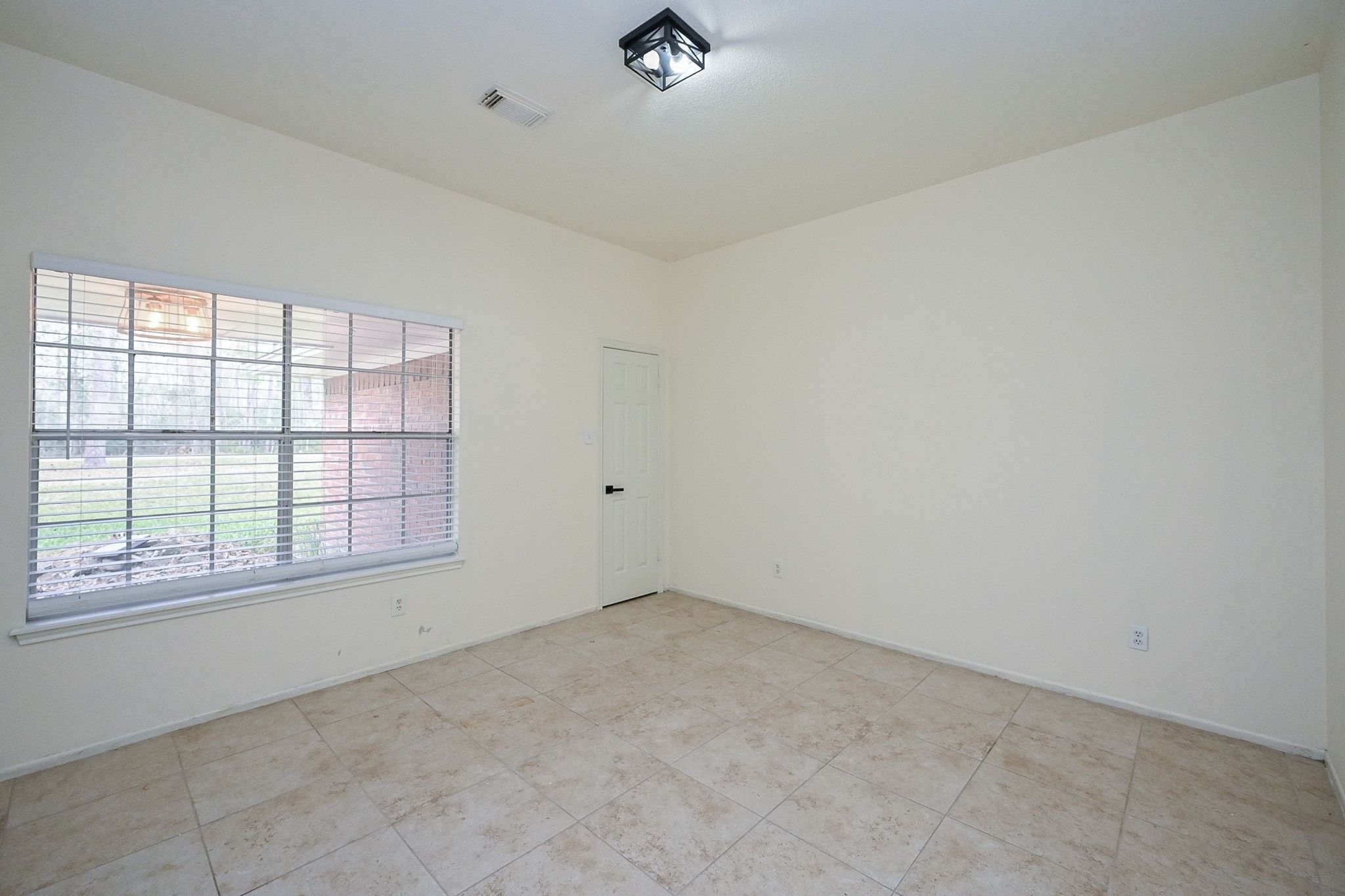 17831 Magnolia Lane New Caney, TX 77357 - Photo 3 of 27 Step inside into this grand entryway and enter a formal living space. Notice the gorgeous, easy-to-maintain tile flooring!