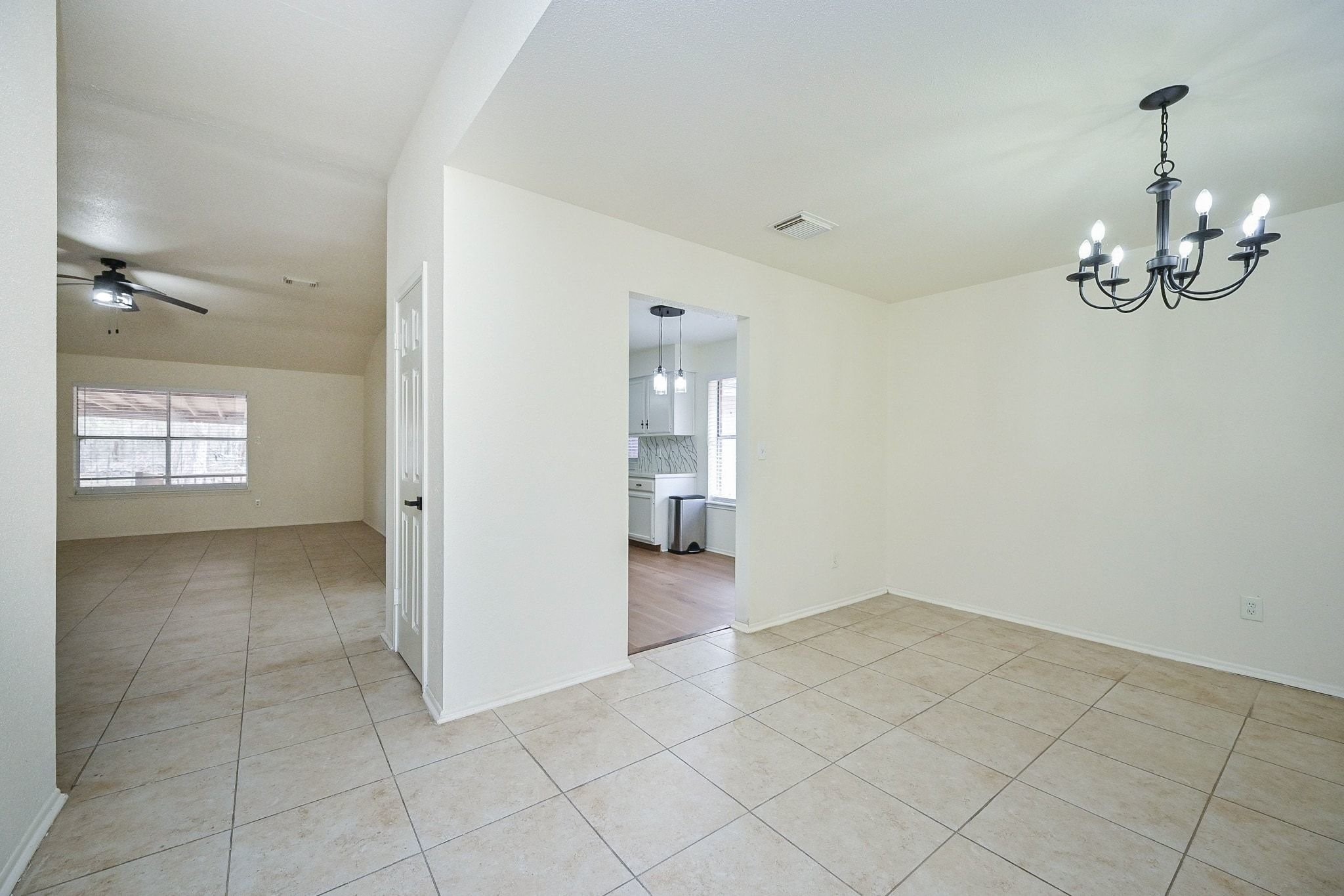 17831 Magnolia Lane New Caney, TX 77357 - Photo 4 of 27 Here is the lovely formal dining space! The gorgeous light pendant that hangs above adds a wonderful modern touch to it and the gorgeous flooring flows throughout the home.