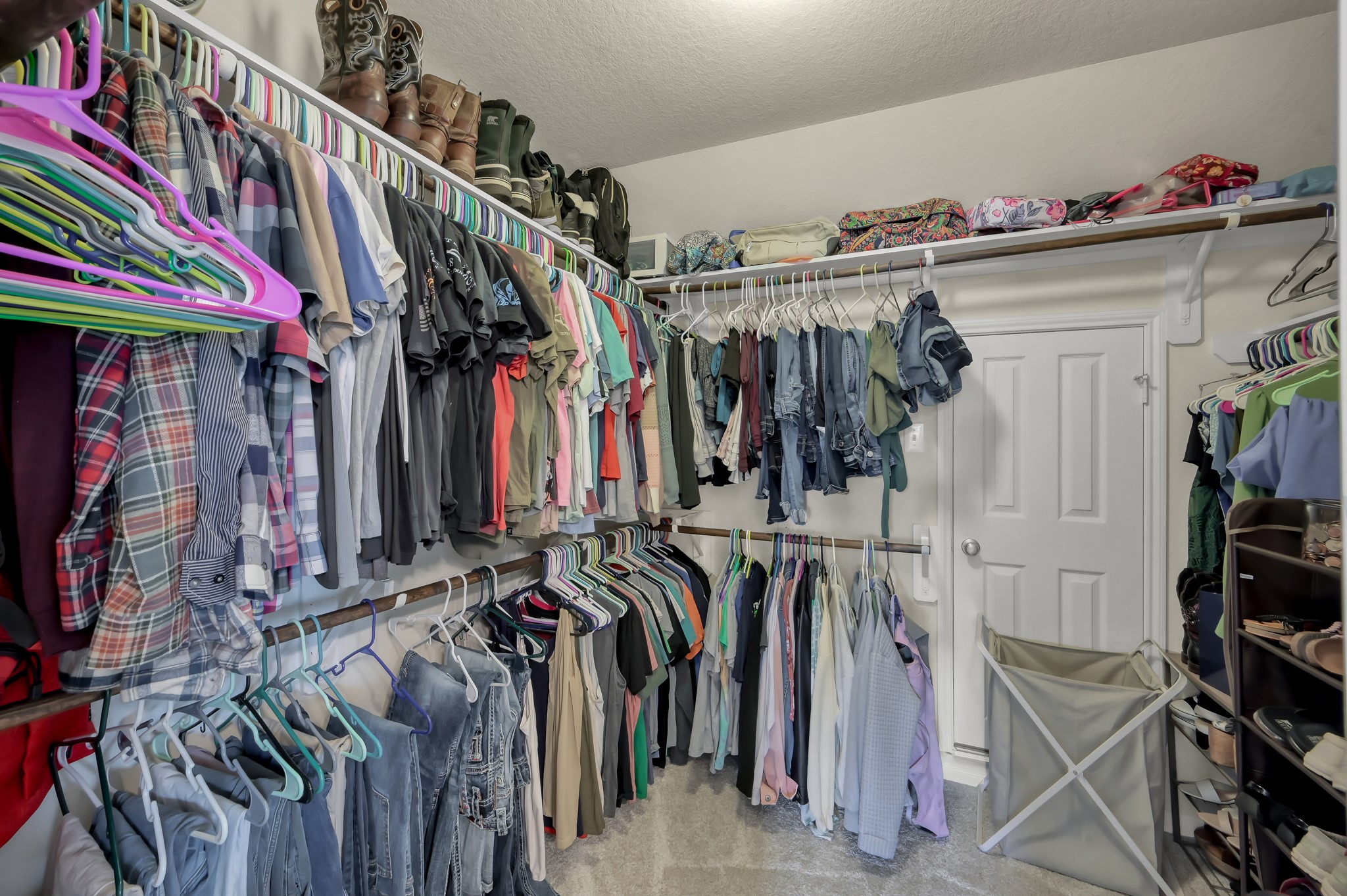 21550 Rainfall Park Drive Spring, TX 77388 - Photo 19 of 38 a view of walk in closet with clothes