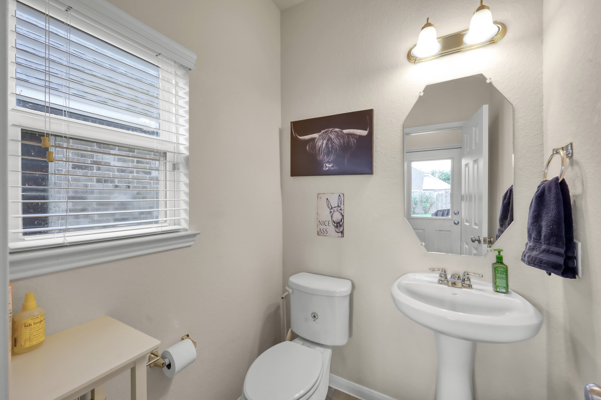 21550 Rainfall Park Drive Spring, TX 77388 - Photo 20 of 38 a bathroom with a toilet sink and mirror