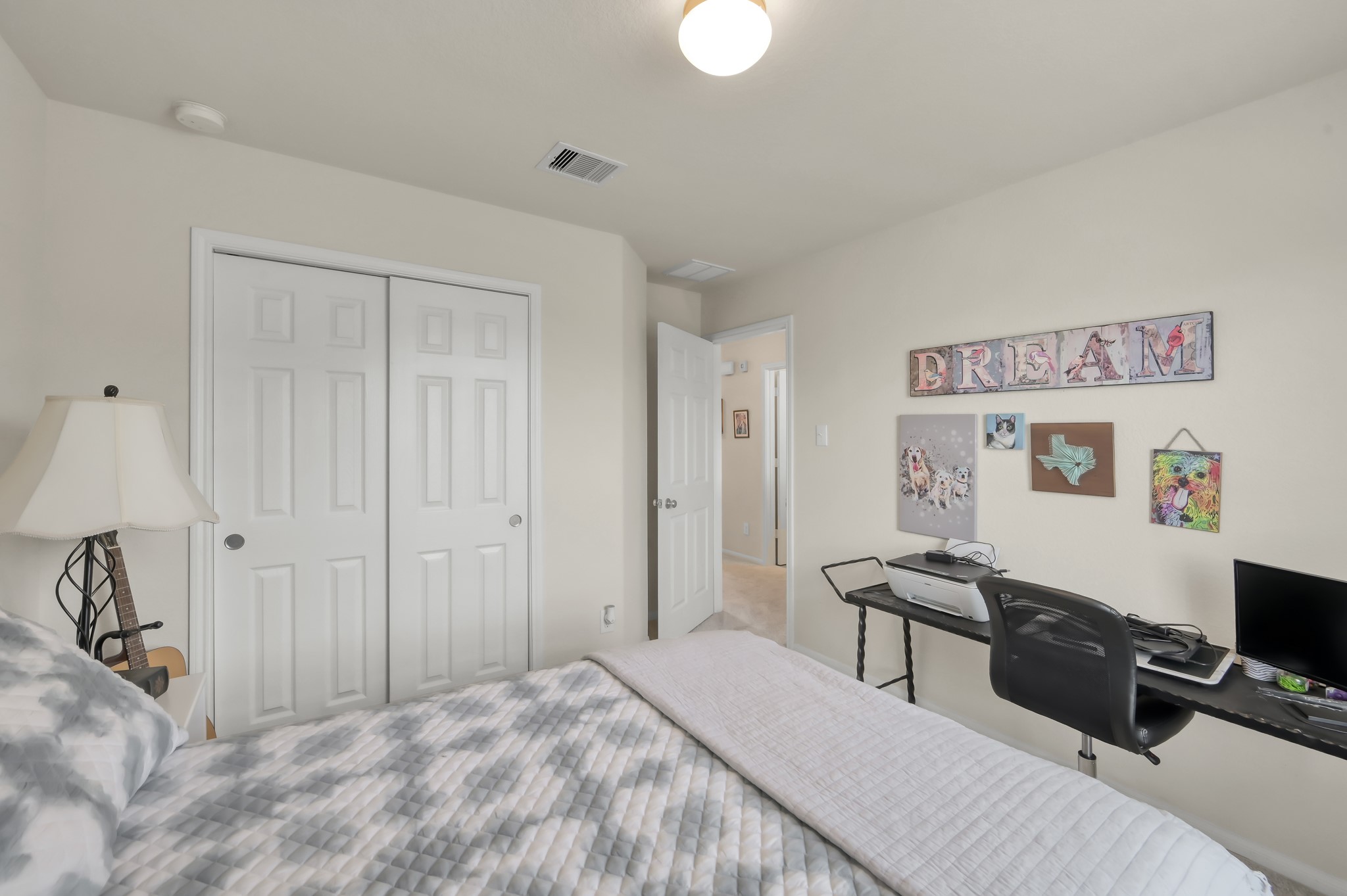 21550 Rainfall Park Drive Spring, TX 77388 - Photo 25 of 38 a bedroom with a bed and a flat screen tv