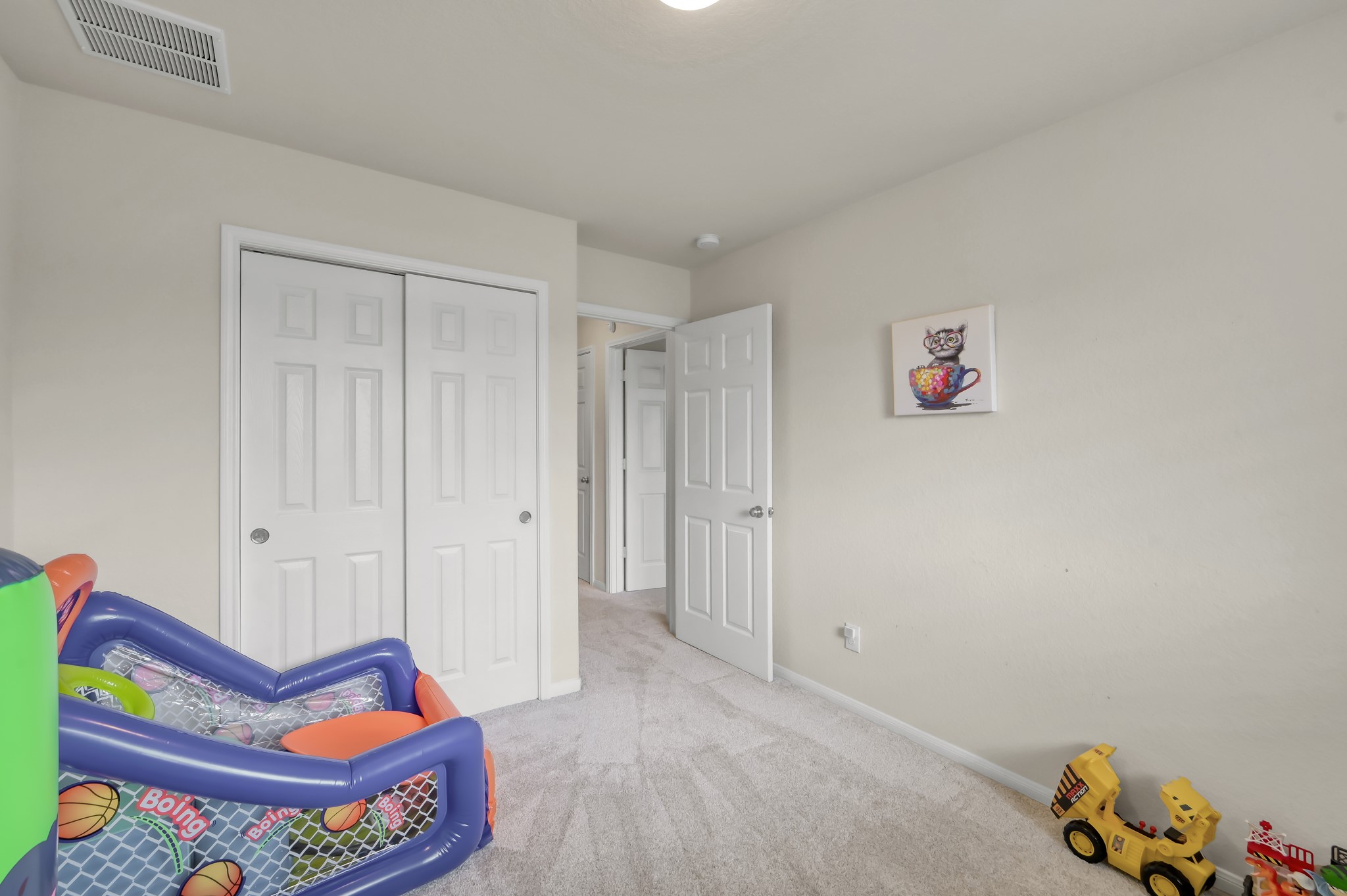 21550 Rainfall Park Drive Spring, TX 77388 - Photo 30 of 38 a bedroom with a bed and a book shelf