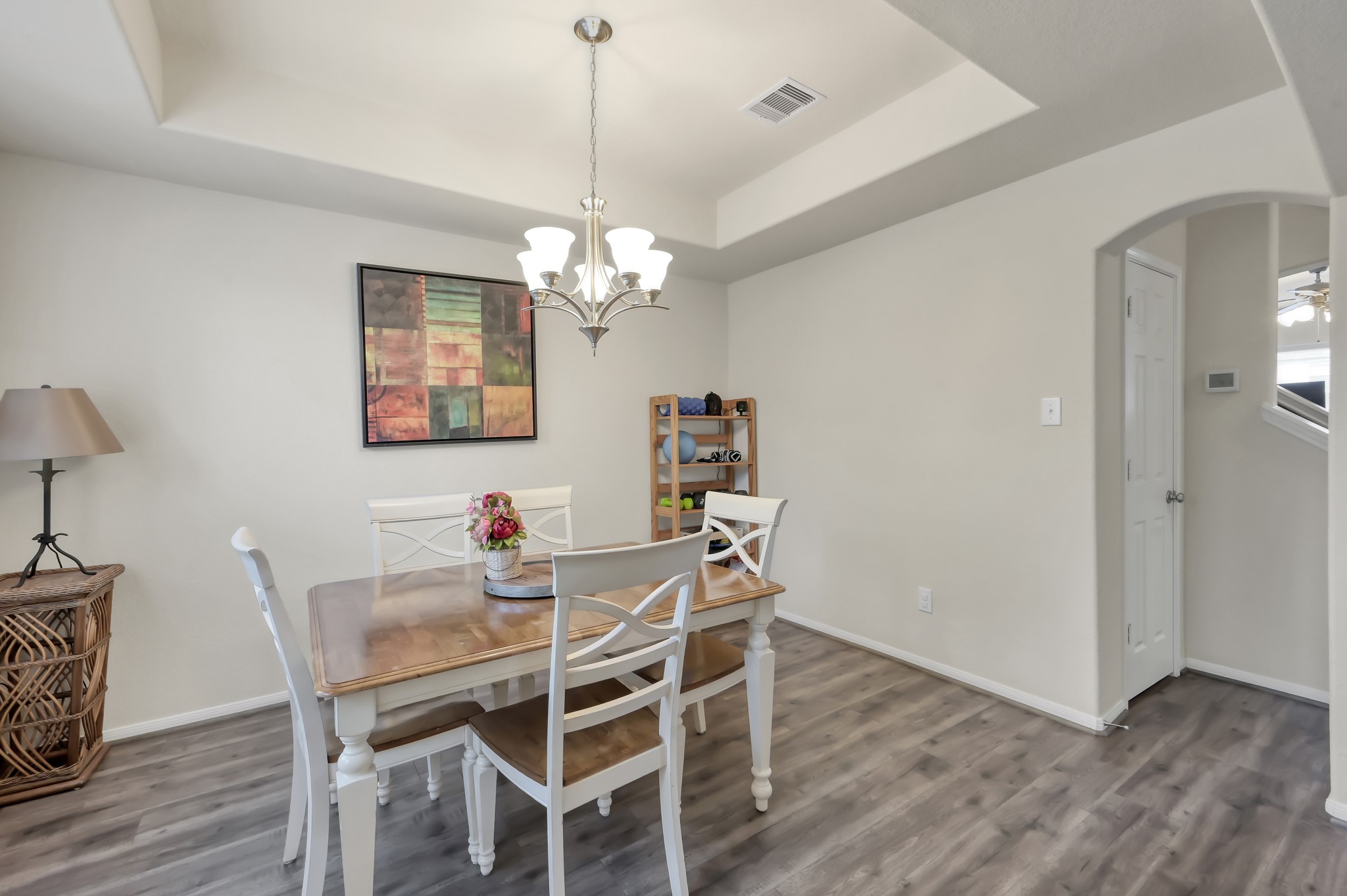 21550 Rainfall Park Drive Spring, TX 77388 - Photo 3 of 38 a view of a dining room with furniture wooden floor and chandelier