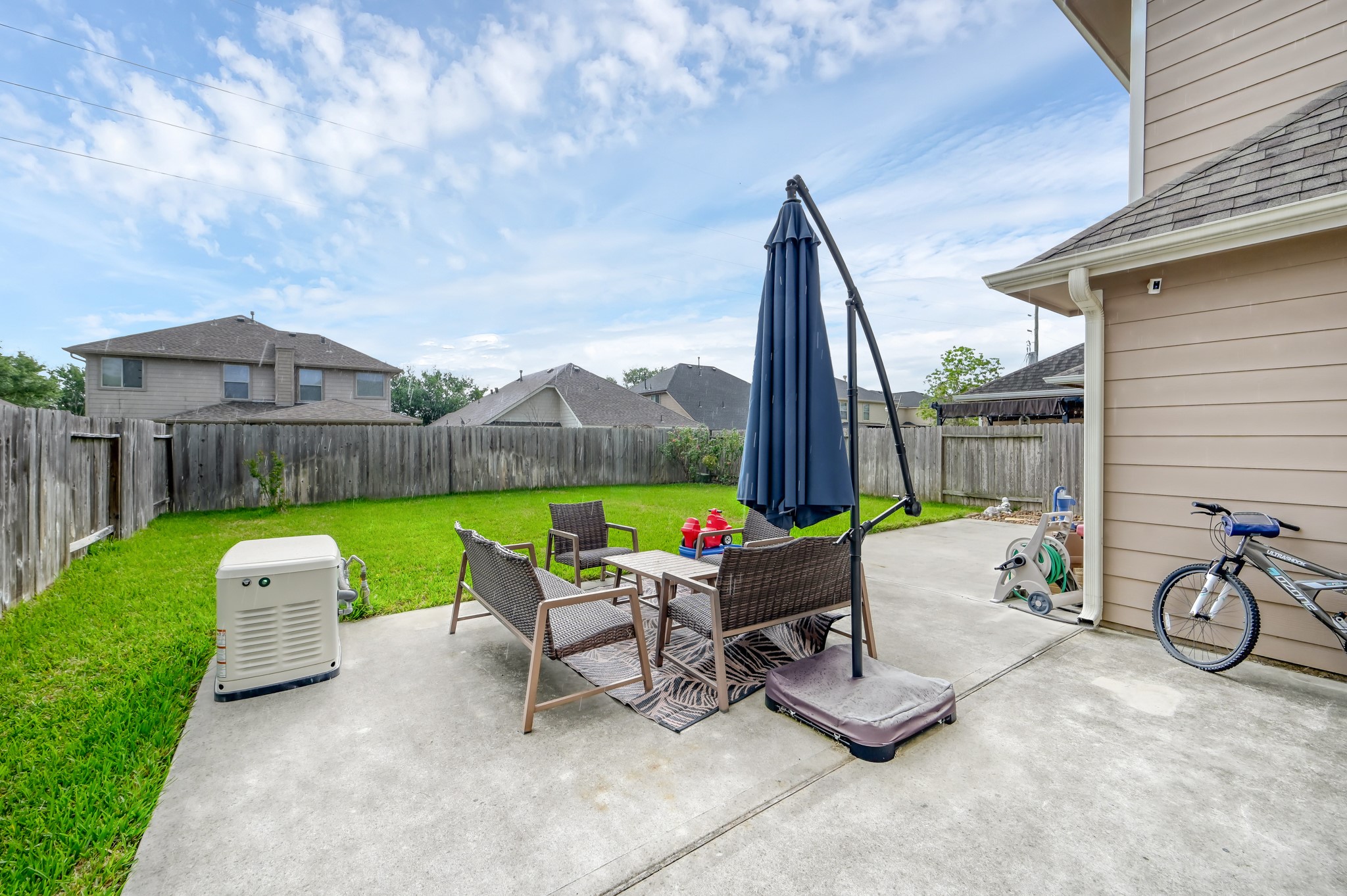 21550 Rainfall Park Drive Spring, TX 77388 - Photo 31 of 38 a view of a patio with chairs and a yard