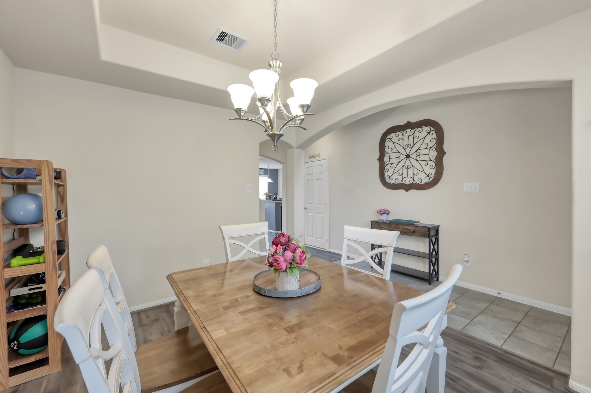21550 Rainfall Park Drive Spring, TX 77388 - Photo 5 of 38 a view of a dining room with furniture a chandelier and wooden floor