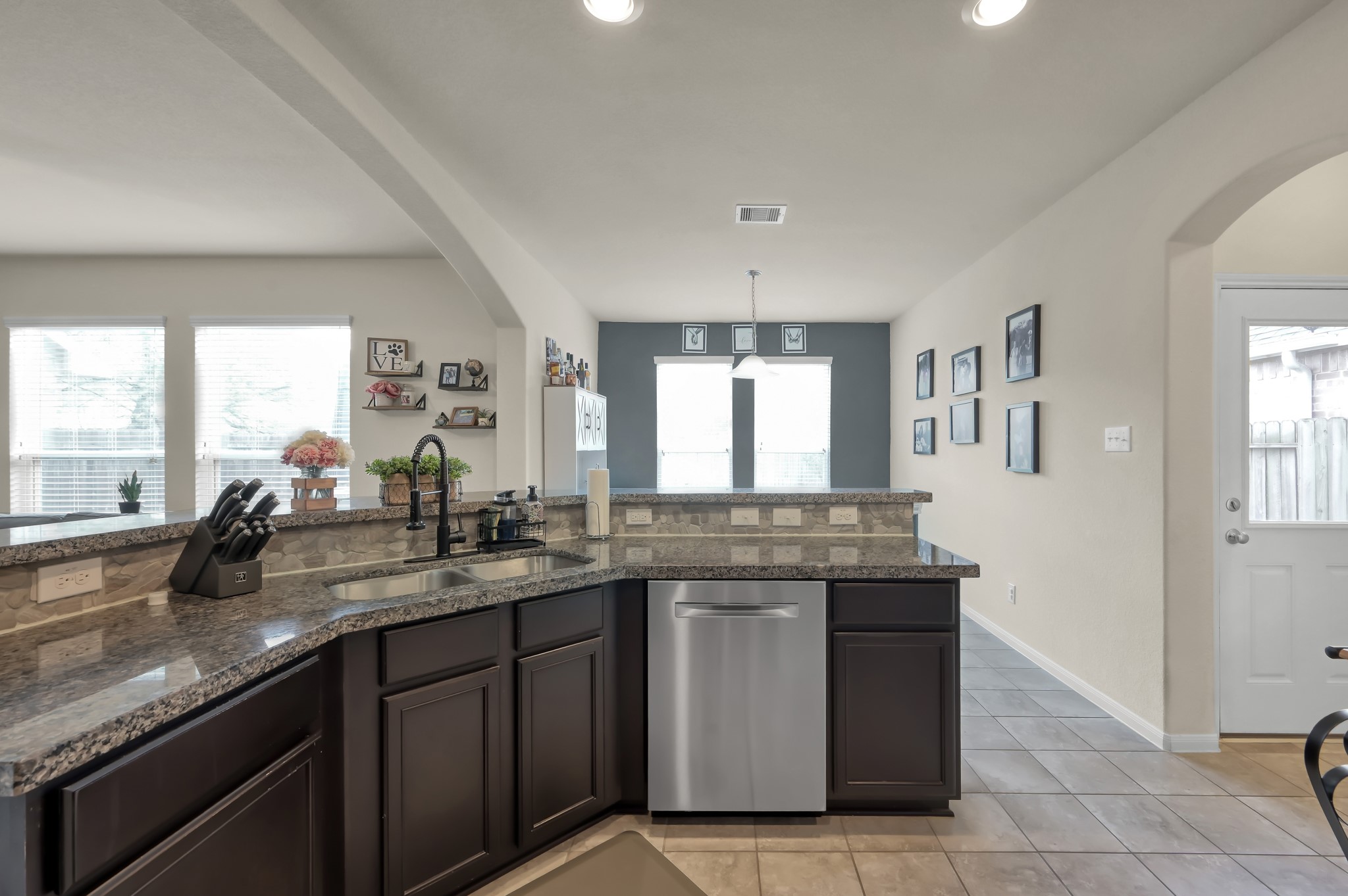 21550 Rainfall Park Drive Spring, TX 77388 - Photo 10 of 38 a kitchen with granite countertop a sink and a stove