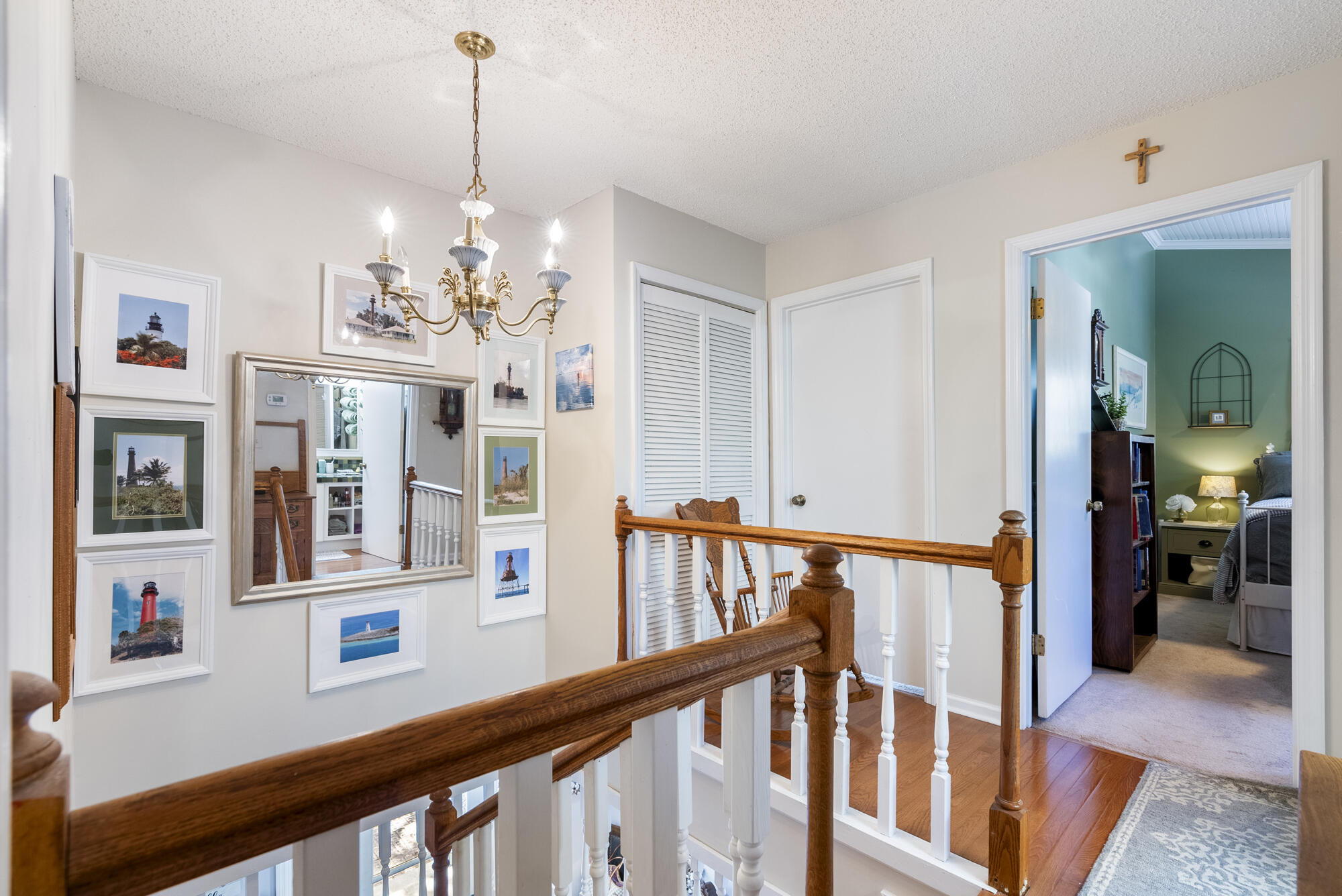 902 Northwest Ave D Carrabelle, FL 32322 - Photo 18 of 32 a view of a dining room with furniture a chandelier and wooden floor