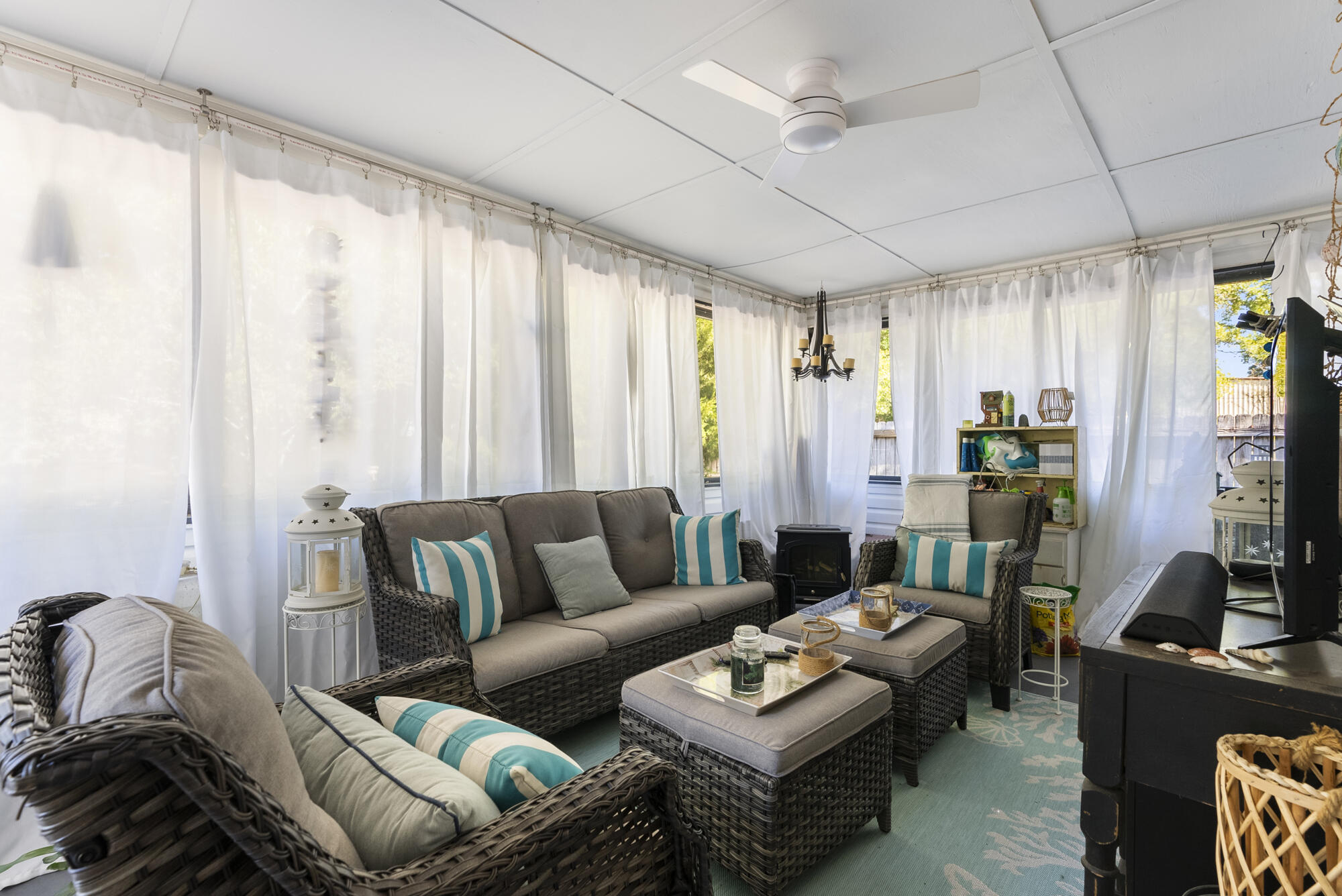 902 Northwest Ave D Carrabelle, FL 32322 - Photo 22 of 32 a living room with furniture and a large window