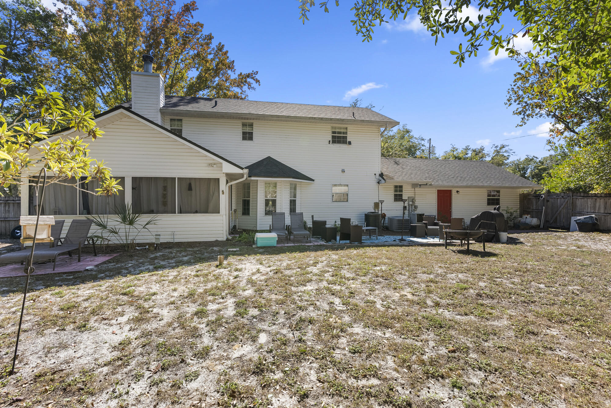 902 Northwest Ave D Carrabelle, FL 32322 - Photo 28 of 32 a front view of a house with a yard and garage
