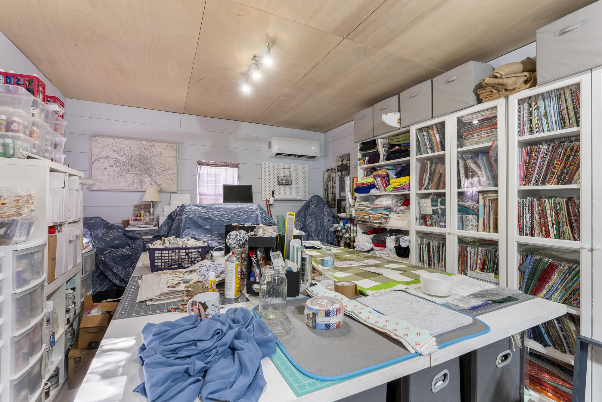 902 Northwest Ave D Carrabelle, FL 32322 - Photo 32 of 32 a living room with lots of furniture and a book shelf