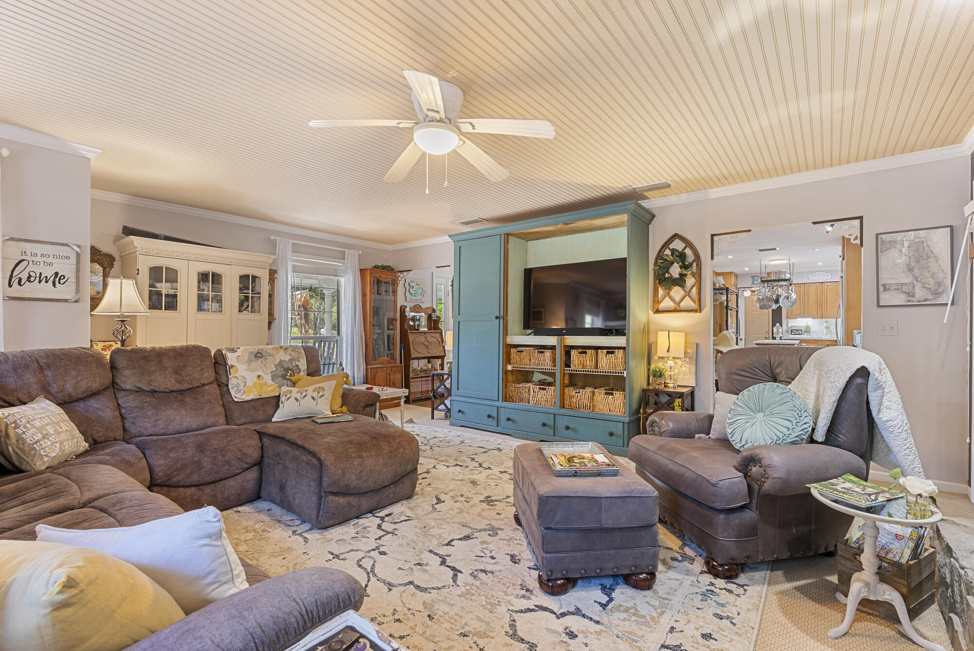 902 Northwest Ave D Carrabelle, FL 32322 - Photo 7 of 32 a living room with furniture and a wooden floor