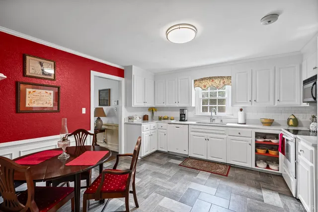 a dining room with furniture and windows