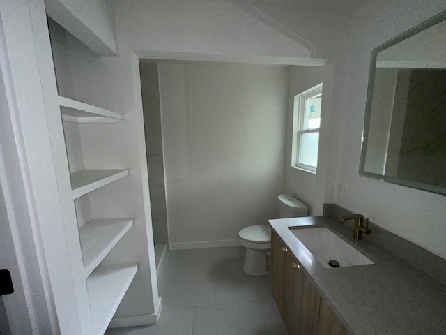 2101 Vanderbilt Lane Austin, TX 78723 - Photo 7 of 11 Full bath featuring vanity and light tile patterned floors