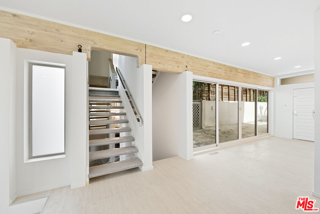 1591 Lindacrest Drive Beverly Hills, CA 90210 - Photo 5 of 17 a view of an empty room with windows