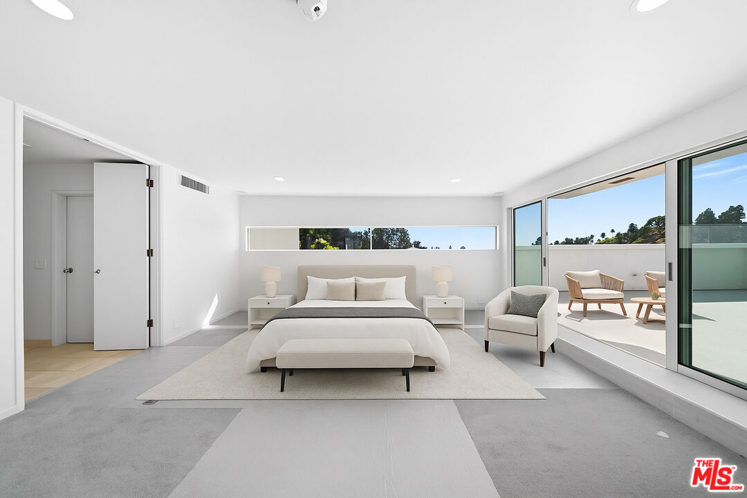 1591 Lindacrest Drive Beverly Hills, CA 90210 - Photo 8 of 17 a spacious bedroom with a bed and large window