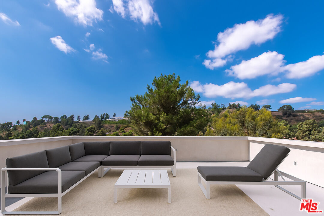1591 Lindacrest Drive Beverly Hills, CA 90210 - Photo 10 of 17 a view of roof with outdoor seating and city view