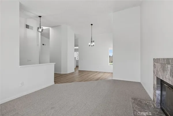 a kitchen with stainless steel appliances a sink cabinets and wooden floor