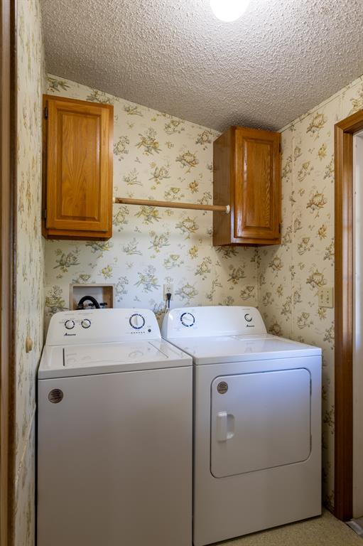 4713 Fox Hollow Road Graham, TX 76450 - Photo 20 of 39 a utility room with dryer and washer
