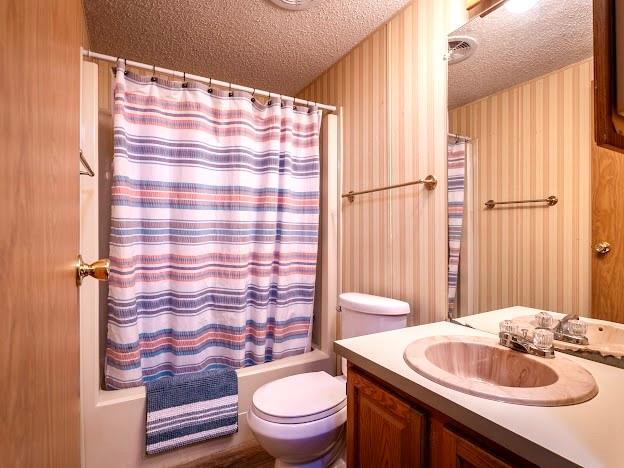 4713 Fox Hollow Road Graham, TX 76450 - Photo 22 of 39 a bathroom with a sink toilet and shower