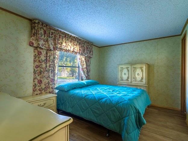 4713 Fox Hollow Road Graham, TX 76450 - Photo 23 of 39 a bedroom with a bed and a window