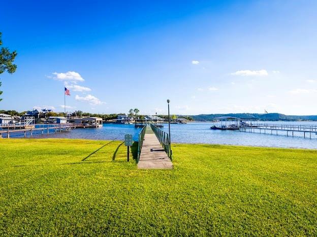 4713 Fox Hollow Road Graham, TX 76450 - Photo 29 of 39 a view of a swimming pool with an ocean view