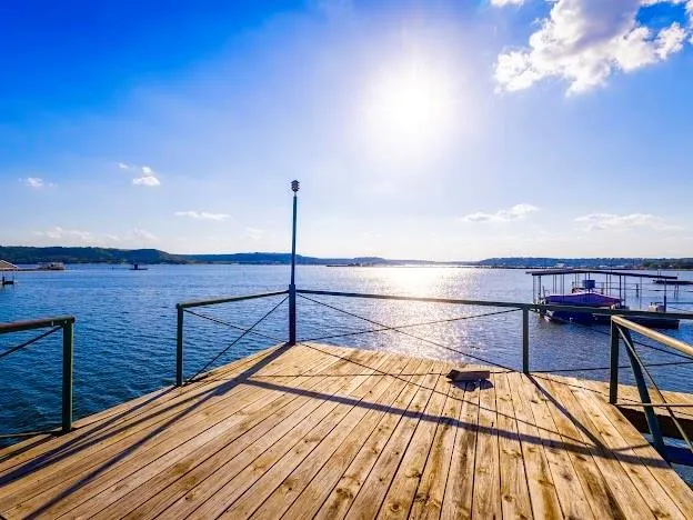 a view of a balcony with wooden floor