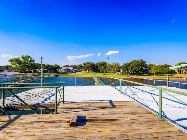 a view of swimming pool with outdoor seating