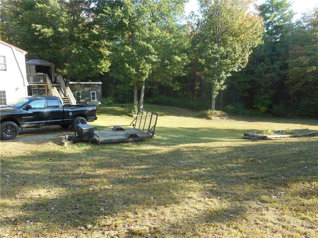 67 Maple Grove South China, ME 04358 - Photo 8 of 33 Backyard view showing deck with...
