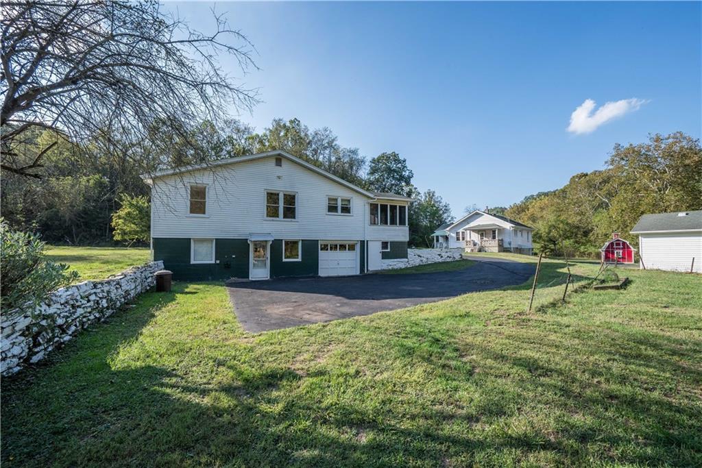 1544 Rte 2023 Monongahela, PA 15063 - Photo 22 of 30 a house with green field in front of it