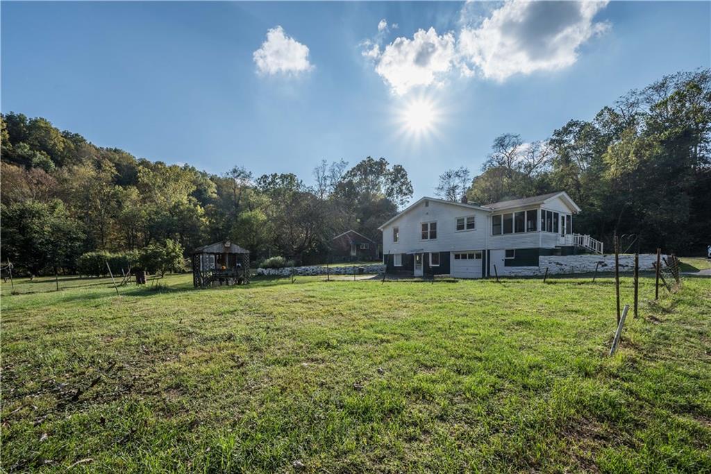 1544 Rte 2023 Monongahela, PA 15063 - Photo 27 of 30 a view of a house with a big yard and a large tree