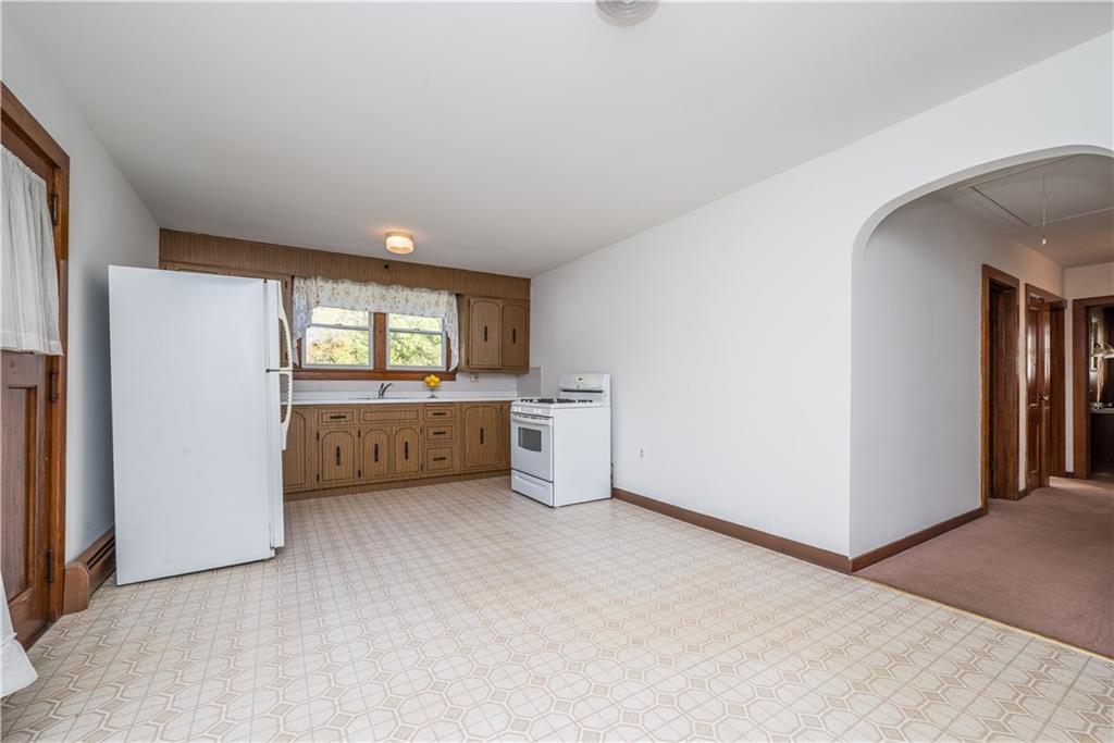 1544 Rte 2023 Monongahela, PA 15063 - Photo 7 of 30 a view of an empty room with a window and a kitchen