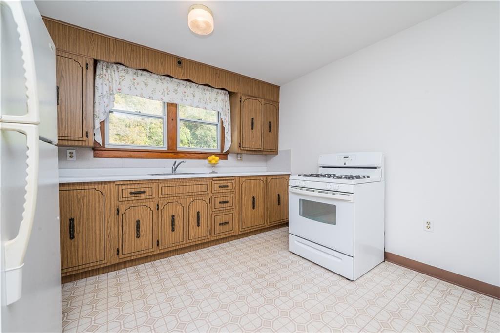 1544 Rte 2023 Monongahela, PA 15063 - Photo 9 of 30 a kitchen with stainless steel appliances granite countertop a stove a sink and a microwave