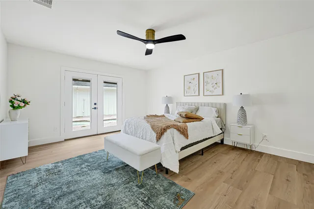 a spacious bedroom with a bed and a couch